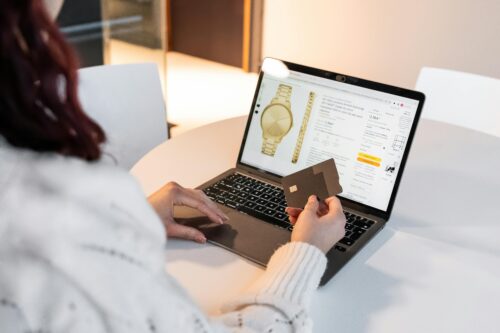 Woman with credit card and laptop